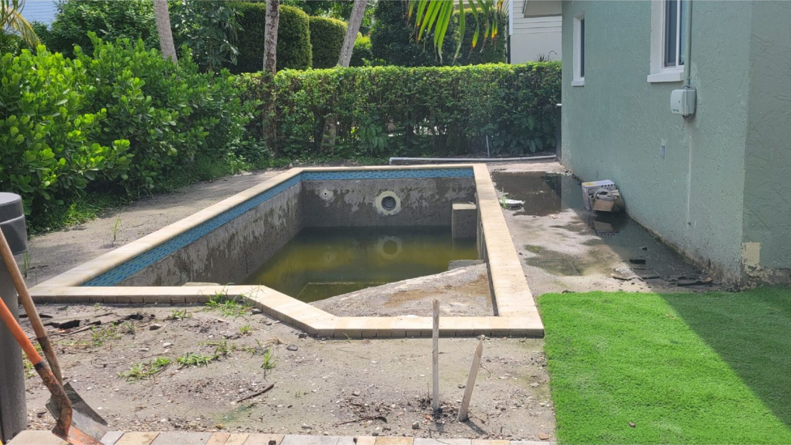 Before: a narrow backyard pool prior to installation