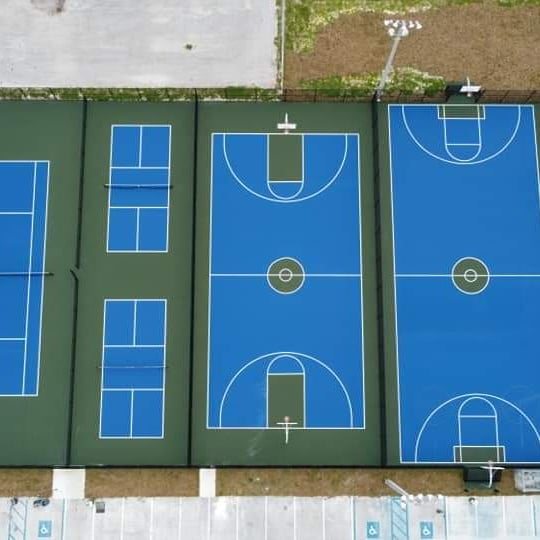 Aerial view of pickleball and basketball courts side by side