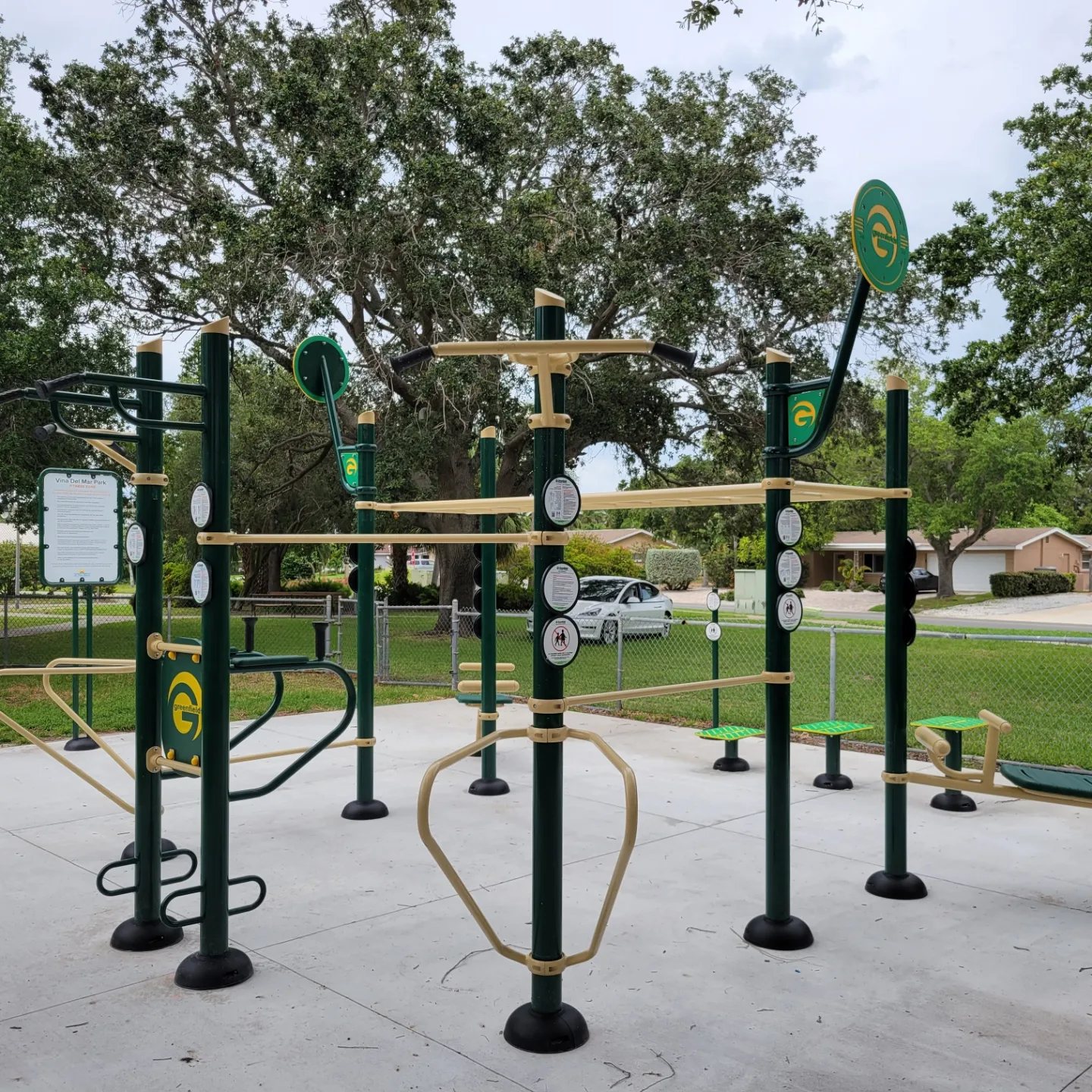 Outdoor fitness equipment on a concrete pad